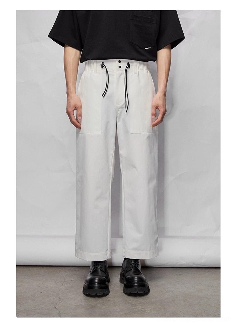 Wide relaxed straight-cut streetwear pants with adjustable waist and utility pocket styling