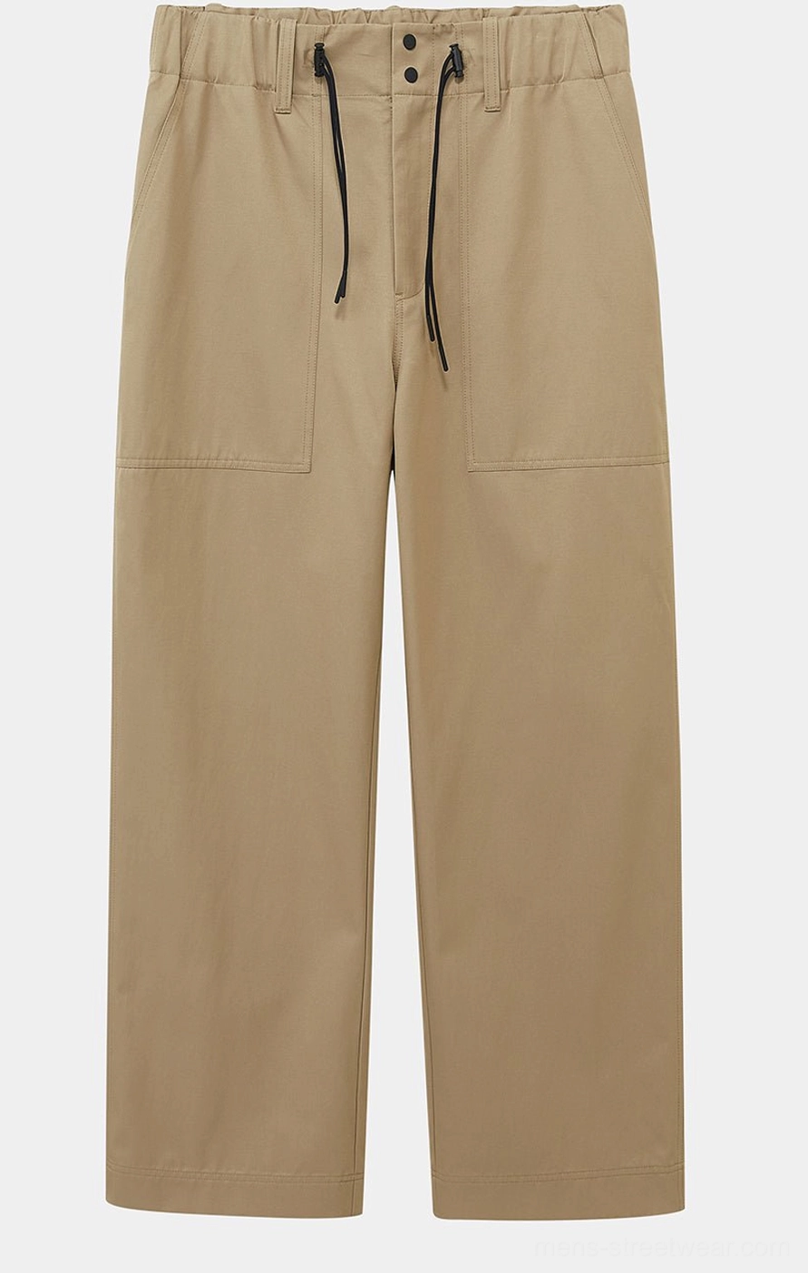 Khaki mid-length streetwear shorts with a wide relaxed silhouette for casual summer outfits