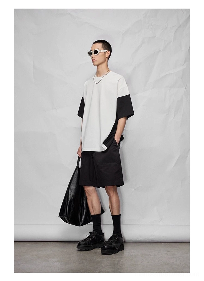 Cropped and mid-length relaxed streetwear bottoms with layered pocket construction and casual fit