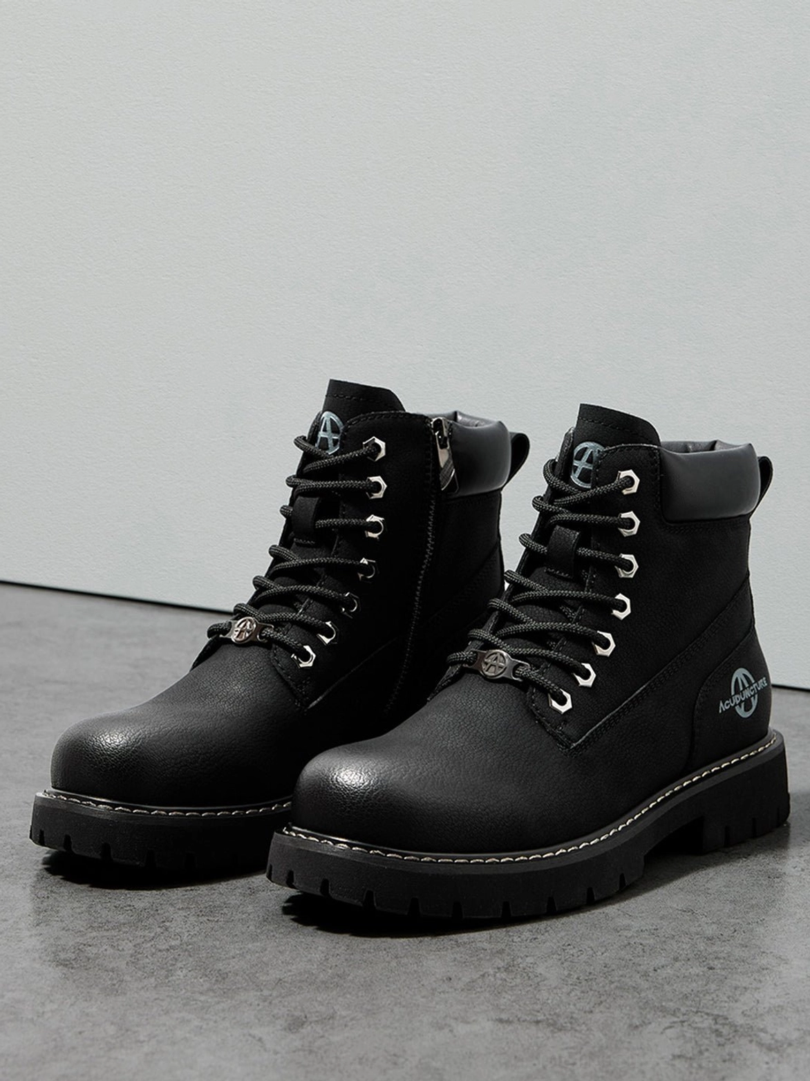 Workwear-inspired lug sole boots for men and women featuring versatile black and yellow color options