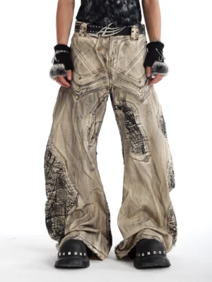 Yellow mud baggy wide-leg denim jeans front view featuring faded distressed wash layered pockets black fossil graphic patches and punk styling