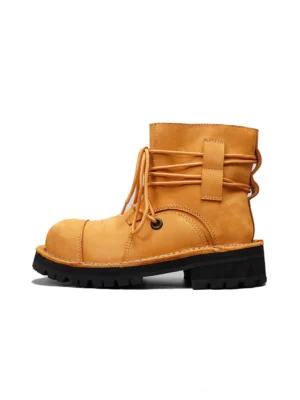 Yellow two-tone leather utility ankle boot side profile with wraparound rear lacing and black lug sole