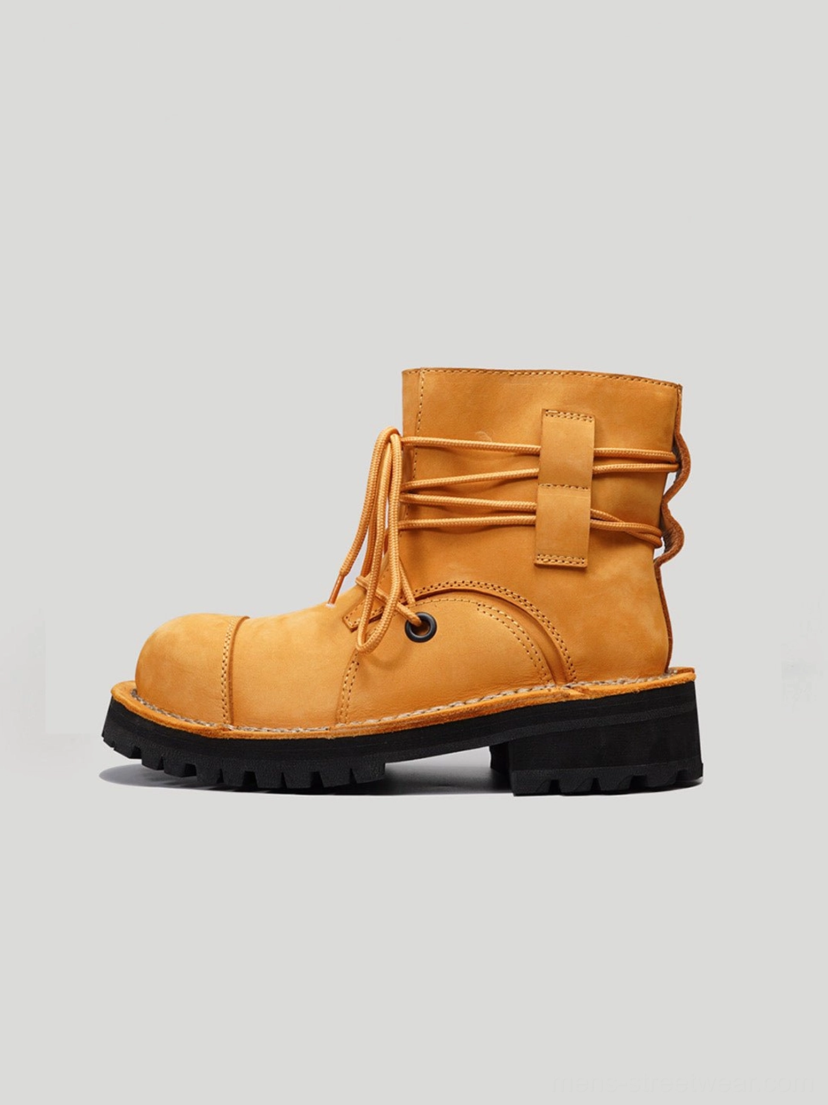 Yellow two-tone leather utility ankle boot side view with padded collar reinforced toe and chunky black outsole
