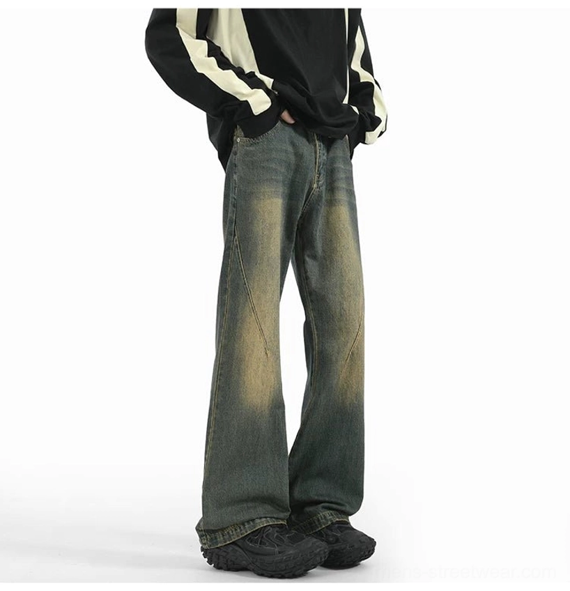 Front view of yellow-toned vintage washed arc flare denim jeans with diagonal seams and relaxed wide-leg silhouette