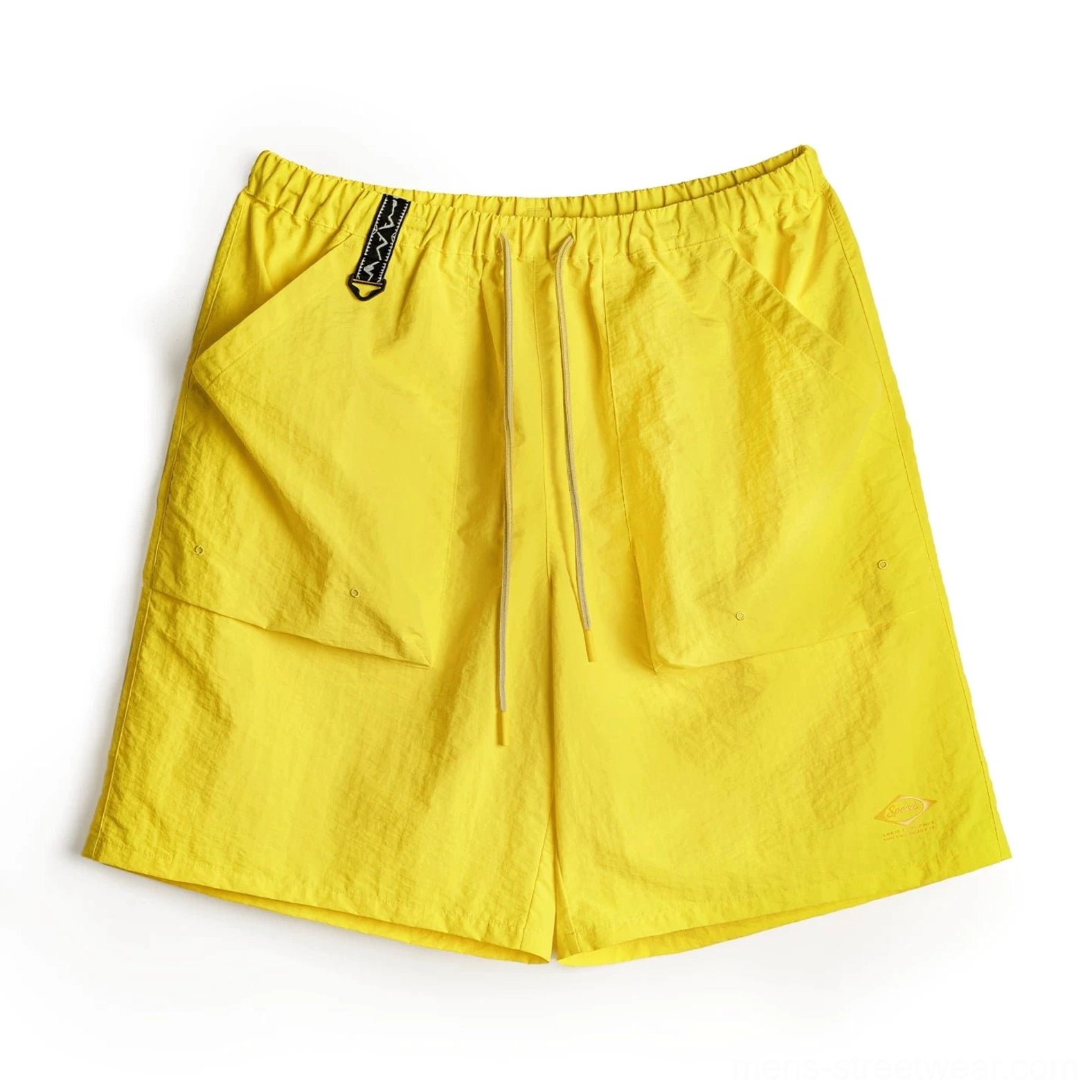Bright yellow water-repellent Taslon cargo shorts with crinkled technical fabric, elastic drawstring waist, oversized flap pockets, utility waist detail, and subtle lower hem mark